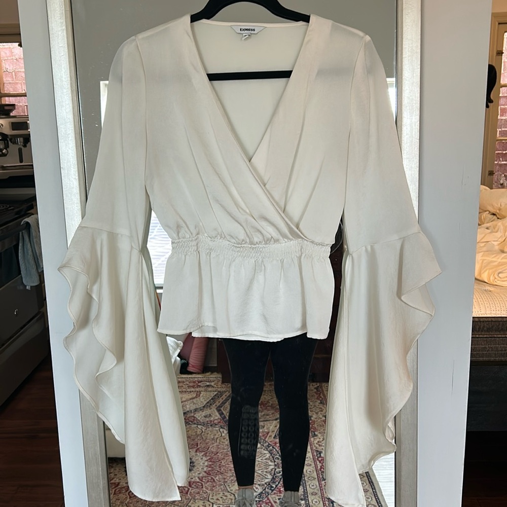Cream peplum top with bell sleeves
